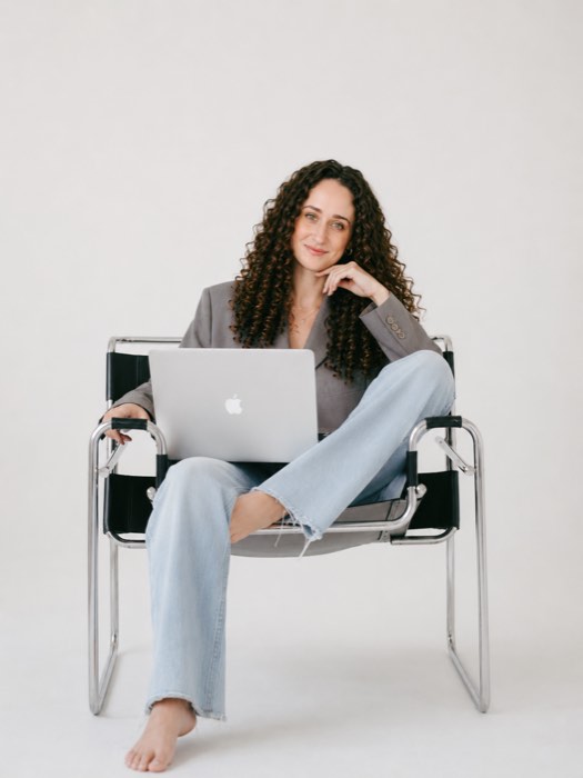 Andrea Diaz working on a laptop