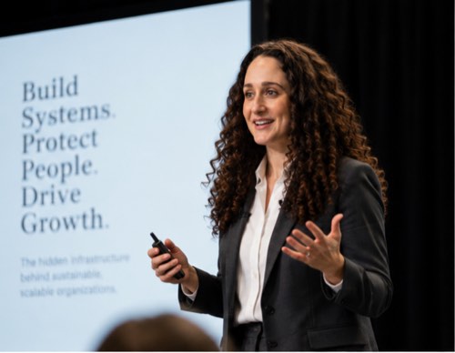 Andrea Diaz speaking on stage